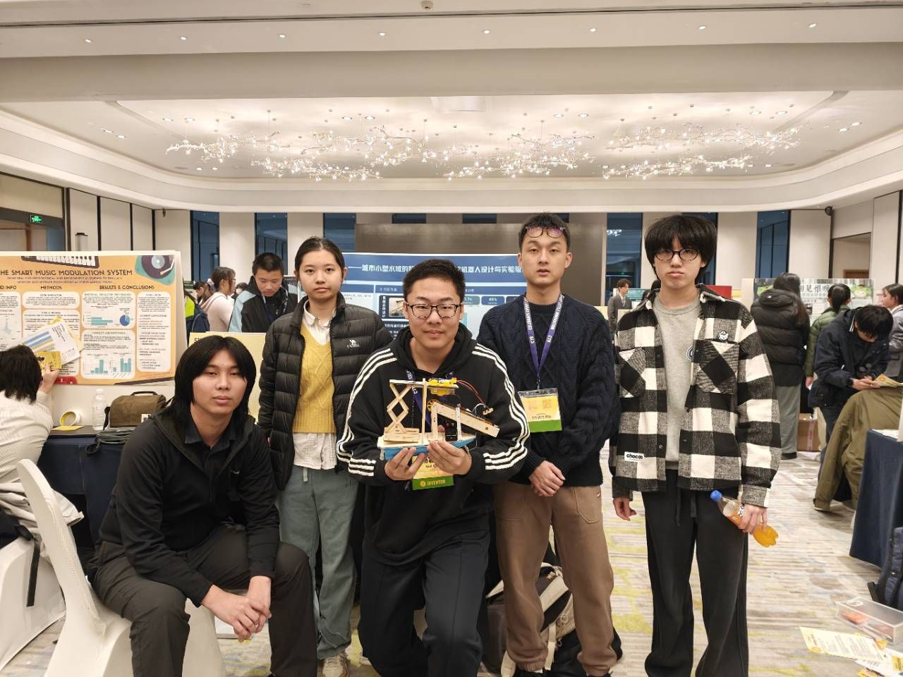 Team with the robot prototype at their CTB exhibition booth