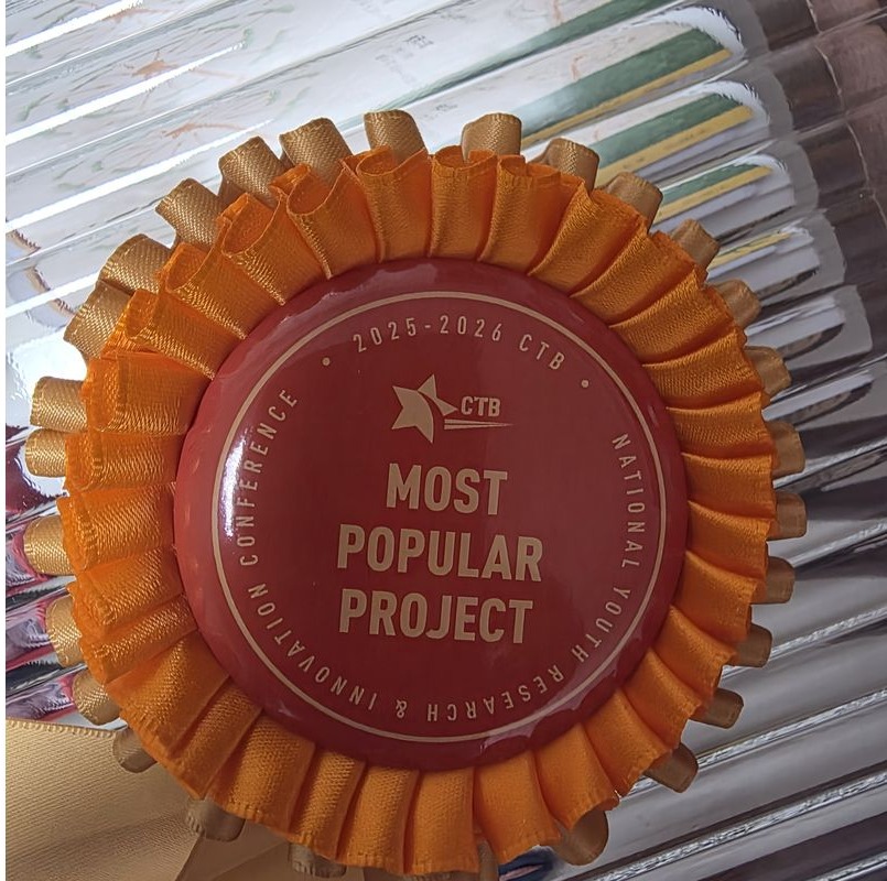 Close-up of the orange 'Most Popular Project' rosette awarded at the CTB National Conference