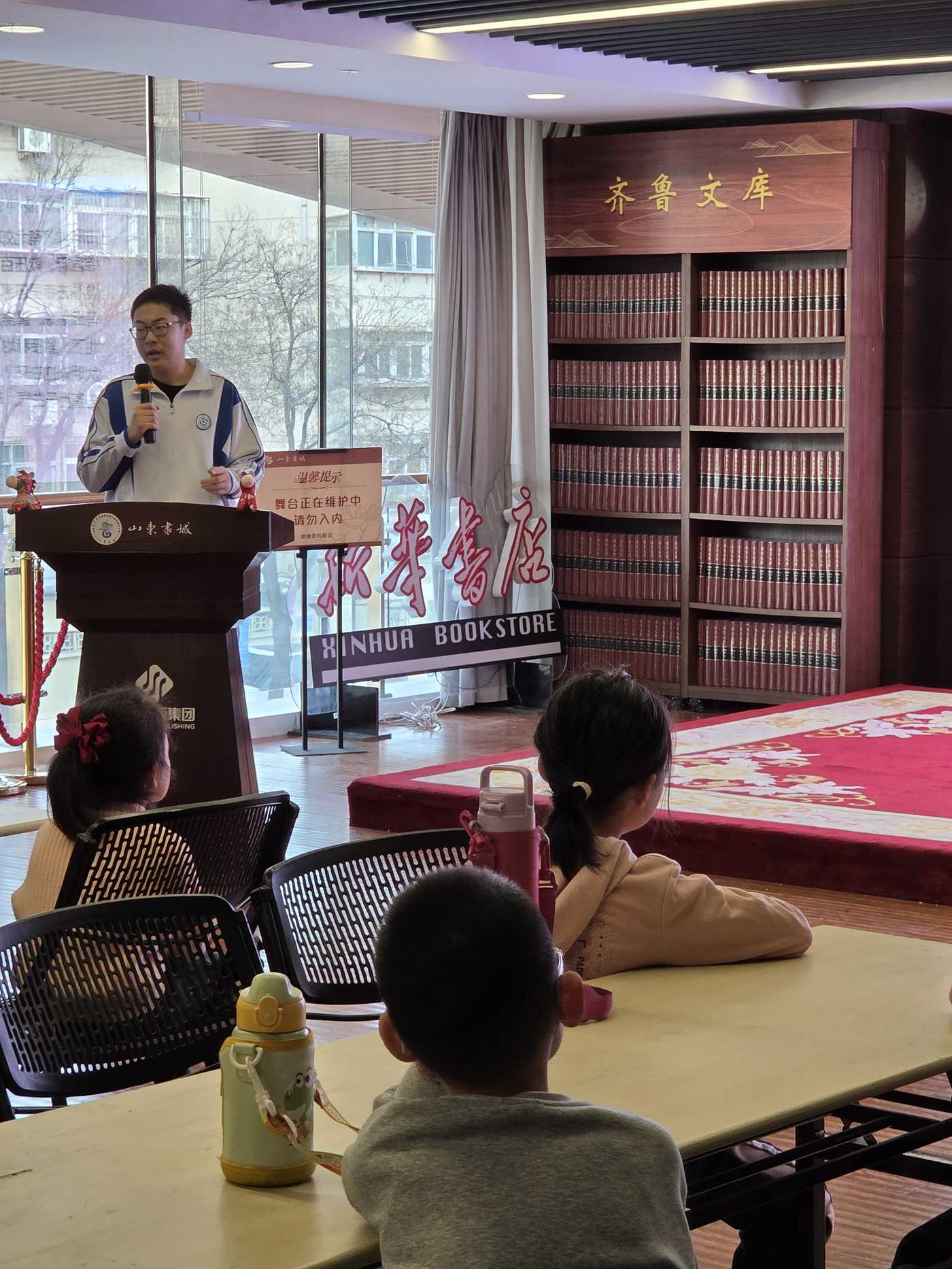 Teaching children at a Shuxiang Tambourine session in Shandong Book City