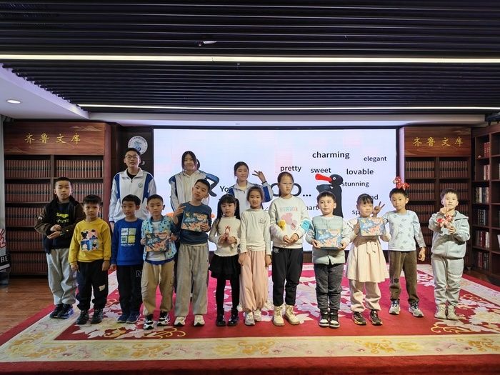 Children holding certificates after a Shuxiang Tambourine session at Qilu Library